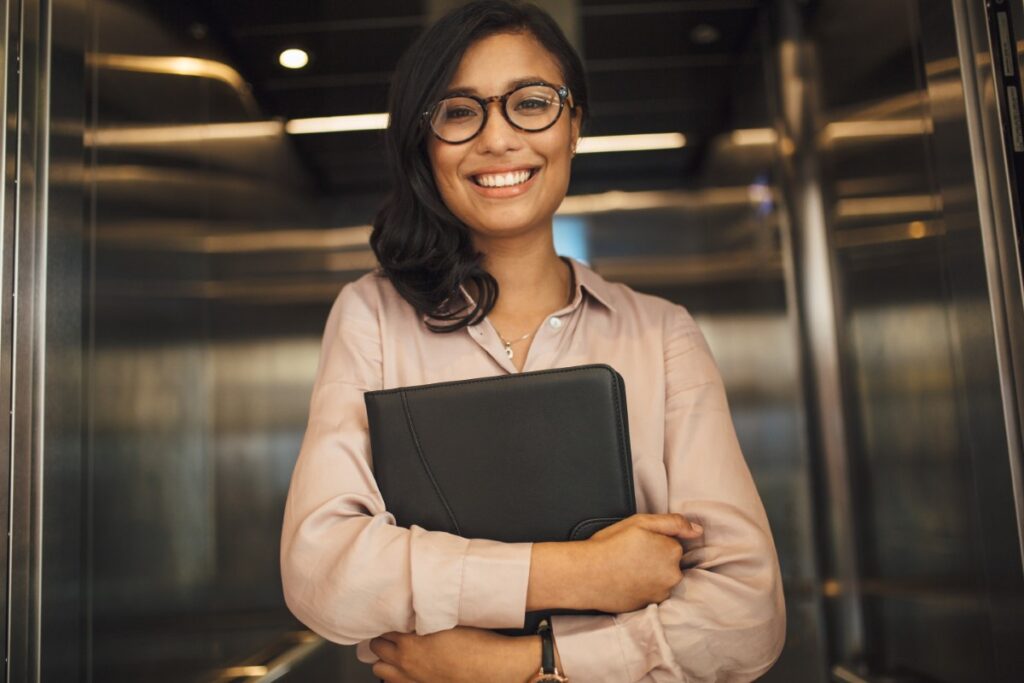 Smiling businesswoman holding a work file